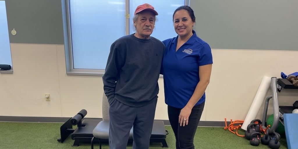 Mark Spaziani, who came to physical therapy with hip pain and painful, limited mobility, poses with expert physical therapist Renee Leonardi.